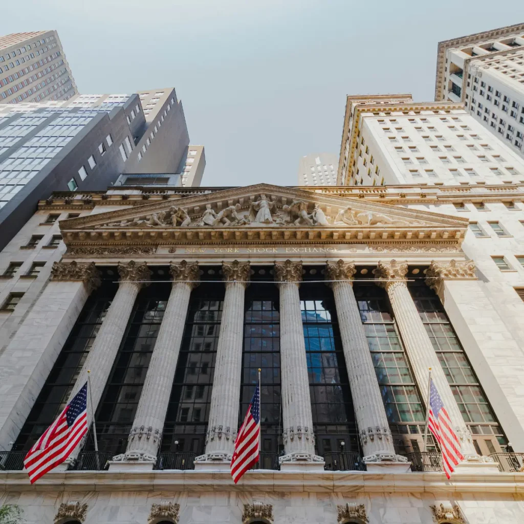 front of the New York Stock Exchange building on Wall St